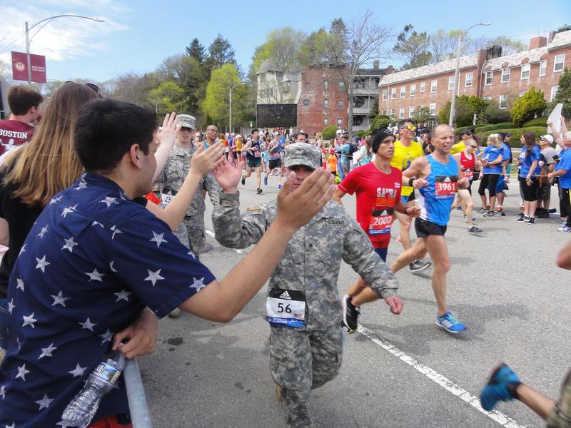 Runner on Boston Marathon course highlighting qualifying times, iconic history, and famous race landmarks.