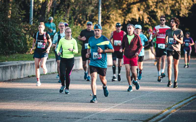 Runner warming up before a hard workout to prevent injuries and improve training recovery.