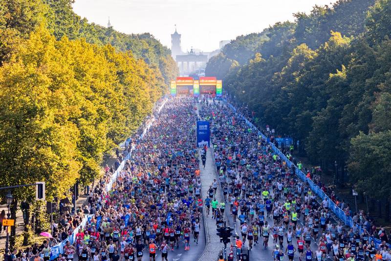 Runner racing the Berlin Marathon fast course, chasing a personal record and marathon PR.