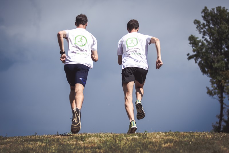 Runner doing hill repeats, focusing on uphill running workout pace and consistent effort.
