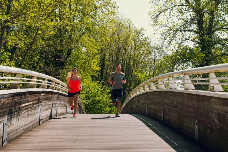 Runner training outdoors, illustrating intrinsic and extrinsic motivation to stay motivated during running workouts.