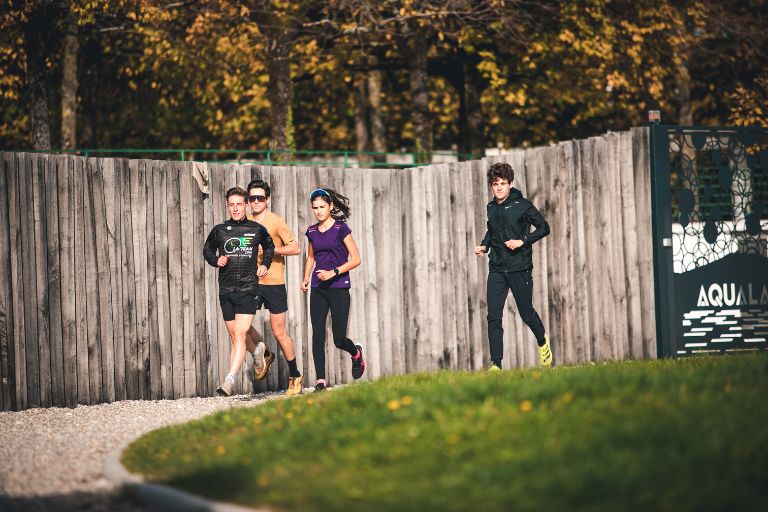 Runner enjoying an easy vacation run on a scenic route, maintaining training without stress.