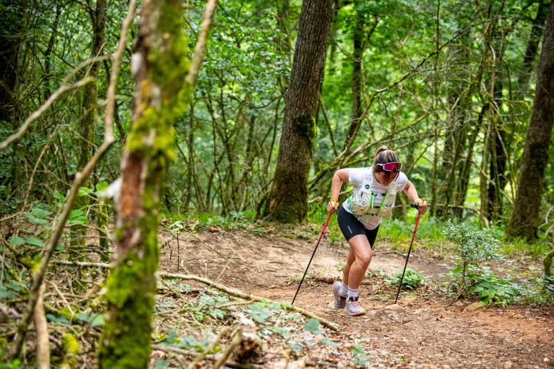 Trail runner completing long hill repeats to build endurance and improve climbing strength on steep trails.