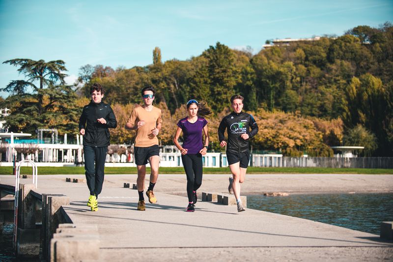 Runner training outdoors with summer running workouts, nutrition guidance, and strength and conditioning tips.