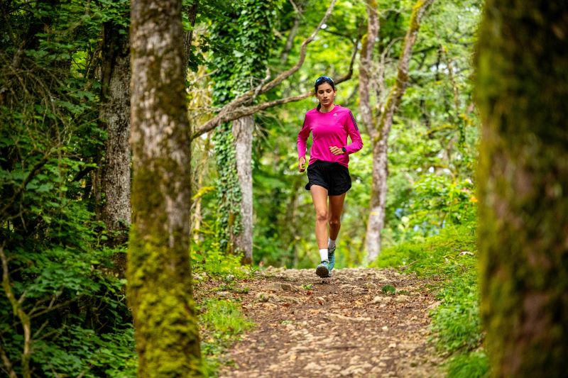 Trail runner performing short hill sprints to build power and improve climbing strength.