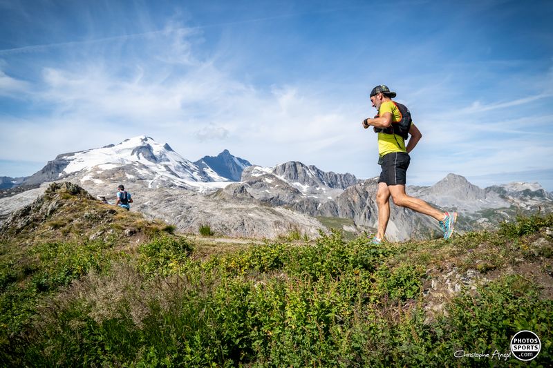 Trail runner training on rocky terrain with strength workout and essential gear for improvement.