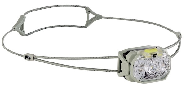 Urban runner wearing a headlamp on a city street, ideal for trail and road running.