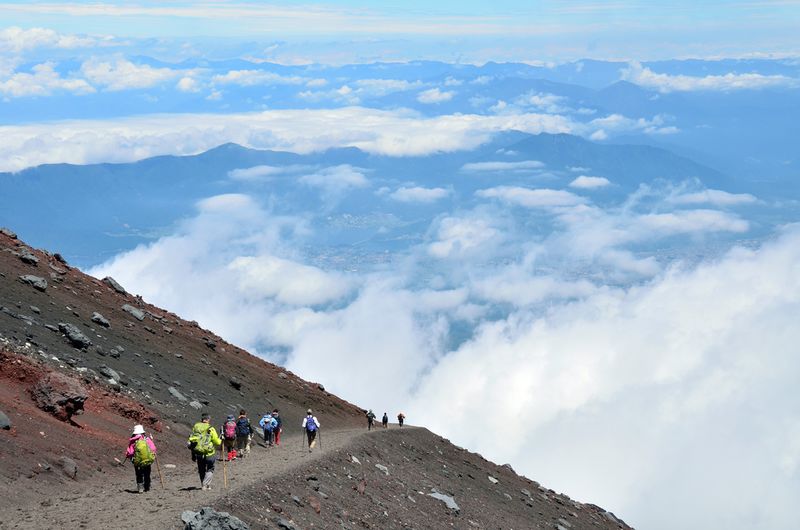 Runner on rugged mountain trail representing toughest ultra-trail races like UTMB and Badwater.