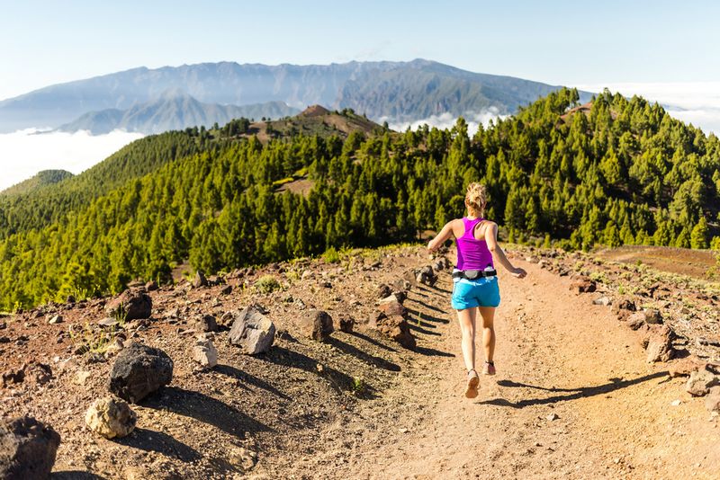 Runner tackling a tough ultra-trail race course inspired by UTMB and Badwater endurance events.