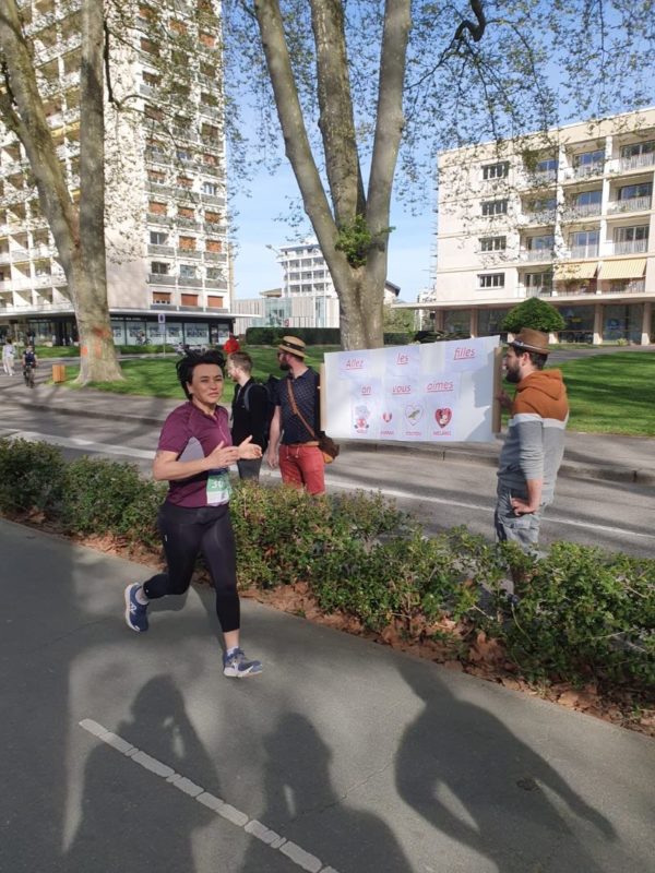 Runner at Annecy Lake during 5K and 10K family double, powered by marathon training.
