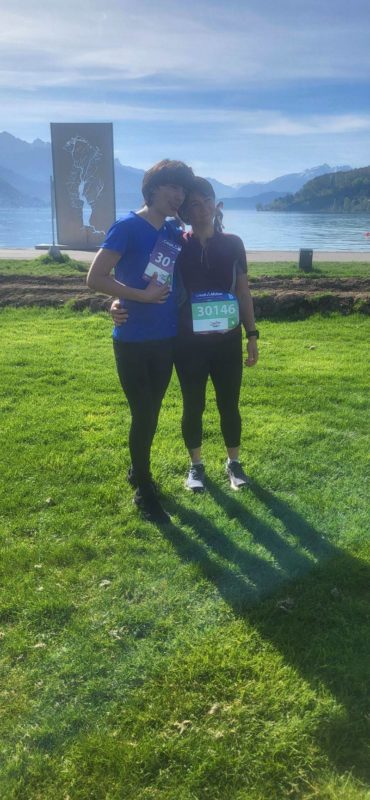 Runner at Annecy Lake during a 5K and 10K family double, fueled by marathon training.
