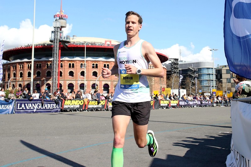 Runner Romain Adam celebrates finishing the Barcelona Marathon in 2:35 after smart training plan.