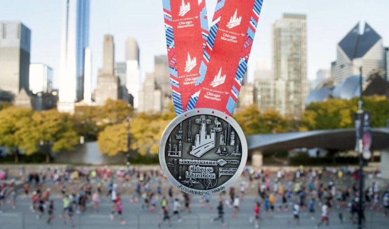 Runner reviewing Chicago Marathon registration guide with course map and tips for securing a bib.