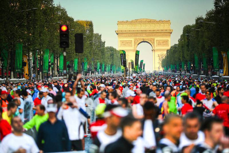 Trail runners racing the EcoTrail Paris Île-de-France event near Paris, scenic endurance running course.
