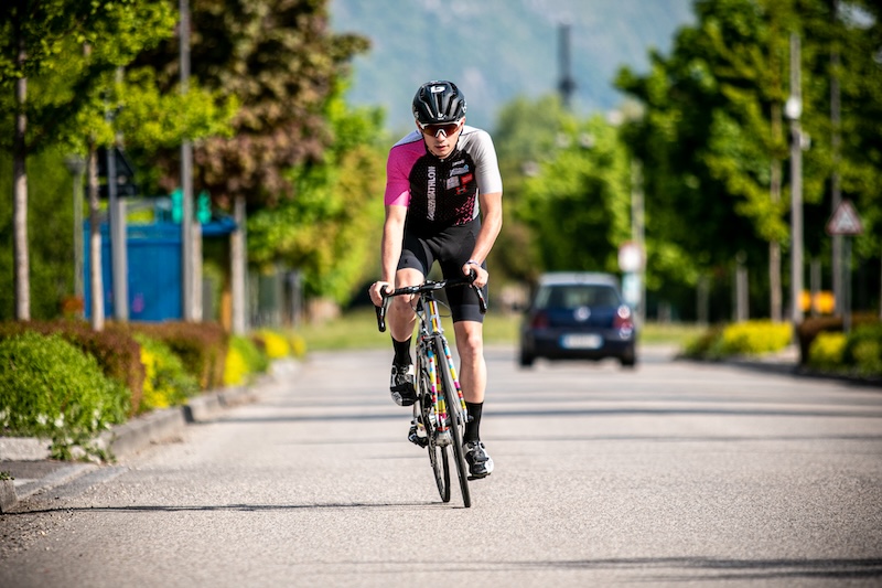 Athlete training for Half IRONMAN 70.3 with 12-week plan, key workouts, and nutrition tips.