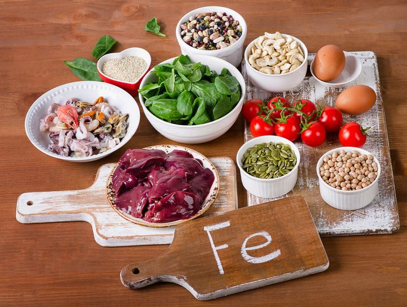 Runner choosing iron-rich foods to address iron deficiency and boost endurance running performance.