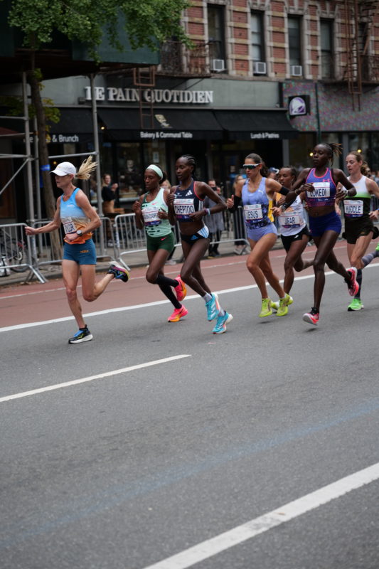 Race-day photos from NYC Marathon 2023, featuring endurance runners captured by RunMotion Coach.