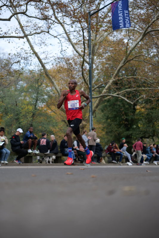 Race-day photos from the NYC Marathon 2023 showing runners in action on the course.
