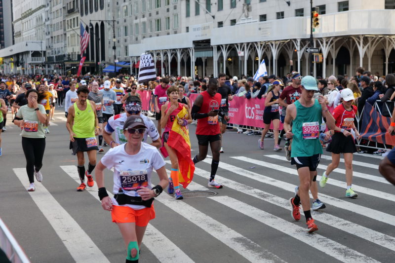 Race-day photos from NYC Marathon 2023 showing runners supported by RunMotion Coach training.