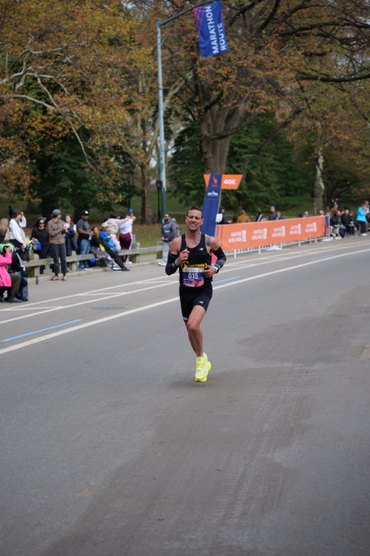 Race-day photos from the NYC Marathon 2023 showing runners and RunMotion Coach support.