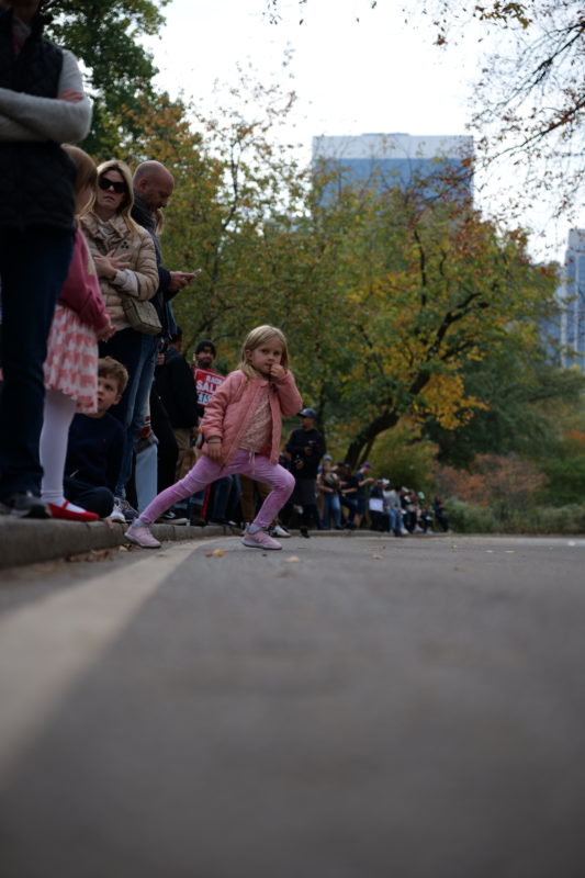 Race-day running photos from NYC Marathon 2023 featuring athletes in action and cheering crowds.