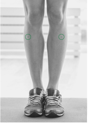 Runner doing post-run recovery with self-massage, shiatsu techniques, and a foam roller for faster healing.