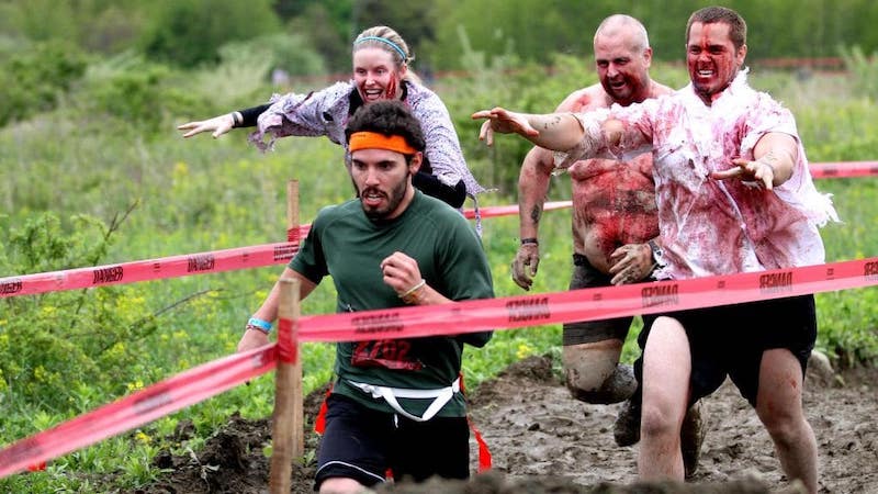 Runner sprinting in the Run for Your Lives wild running race, a scary endurance challenge.