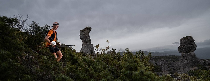 Runner on technical trail at Templiers Trail Festival 2024, highlighting race distances and training tips.