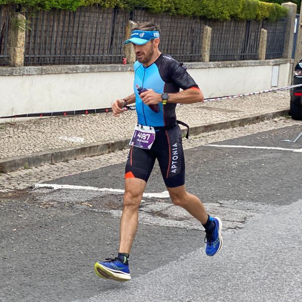 Alex celebrates finishing his first IRONMAN Portugal Cascais triathlon in 10 hours and 56 minutes.