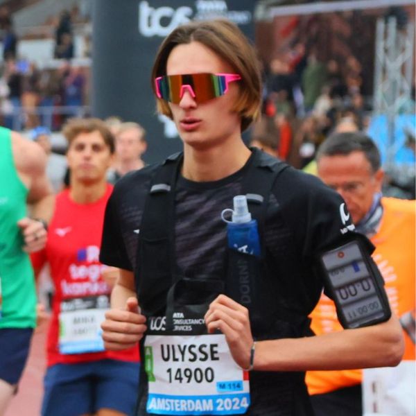 Amsterdam Marathon finisher celebrates completing a six-month journey from 10K running to the marathon.