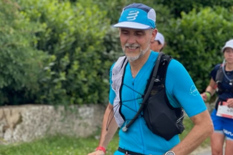 Runner celebrating a first trail running success at the Ultra-Marin 56K endurance race.