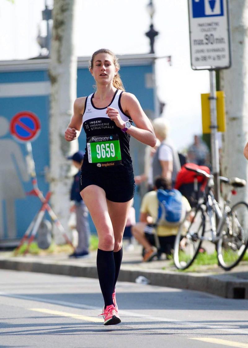 Runner celebrating a Geneva Half Marathon personal best and age group podium finish.