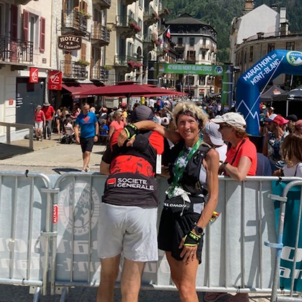 Majida celebrates her age group victory at the Marathon du Mont-Blanc trail running race.