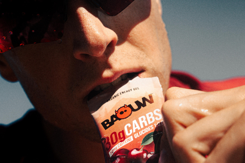 Trail runner preparing night ultra nutrition to build energy stores before the race start