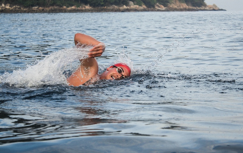 Triathlete building confidence through open water swimming training for race day