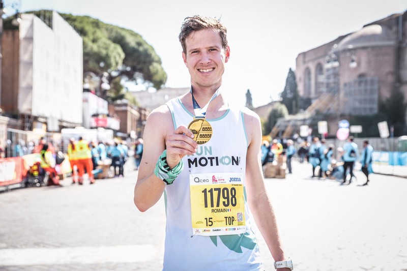 Runner Romain Adam pushing pace at Rome Marathon, nearing a personal best marathon time.