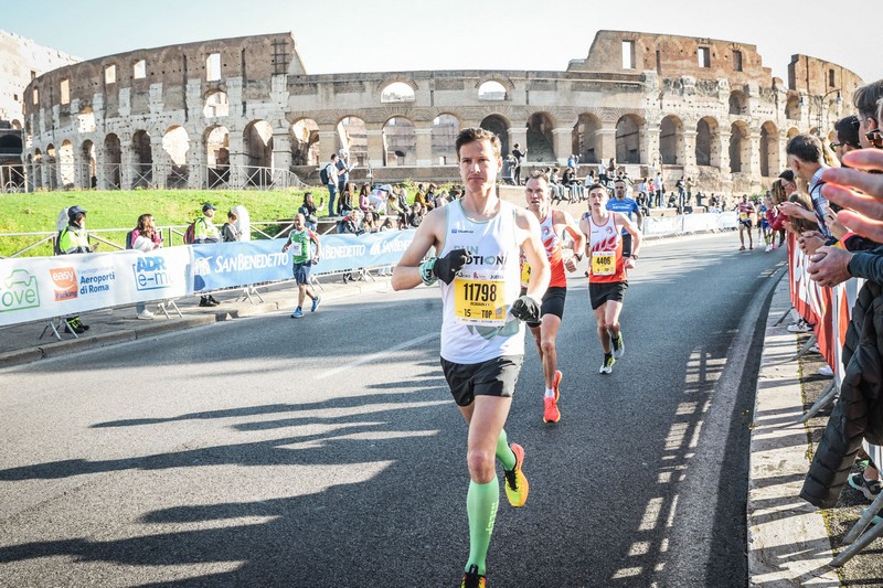 Romain Adam racing the Rome Marathon, nearing his personal best with a strong 2:35 finish.