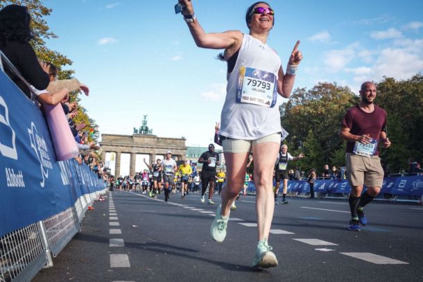 Valérie crossing the finish line of her first Berlin Marathon at 54, celebrating an inspiring running achievement.