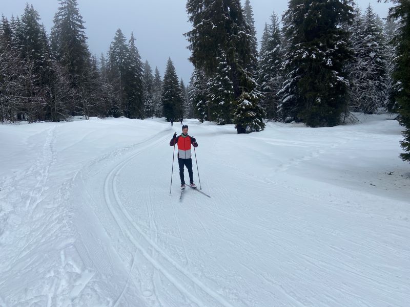 Runner practicing cross-country ski training session to build endurance, strength, and winter fitness.