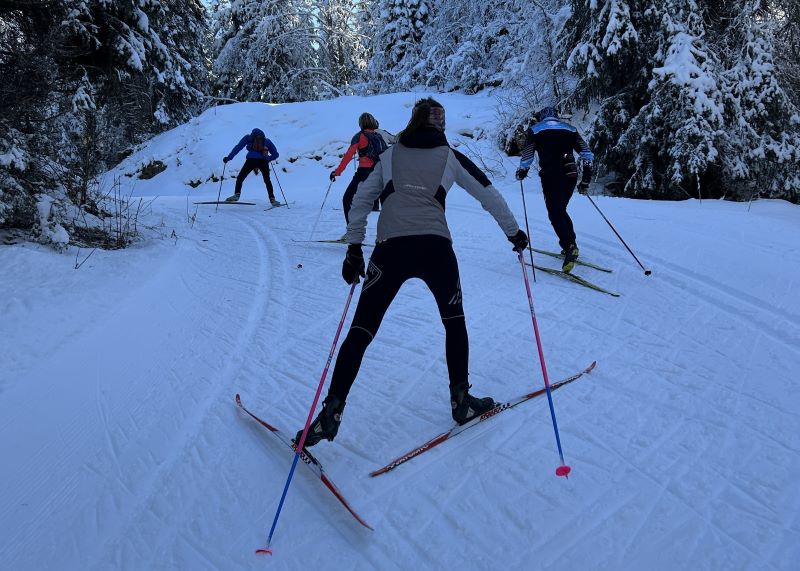 Runner cross-country skiing on snowy trails to build endurance, strength, and aerobic fitness