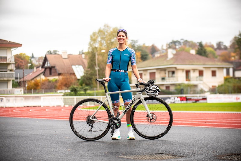 Triathlete fueling with balanced nutrition to support swimming, cycling, and running performance on race day