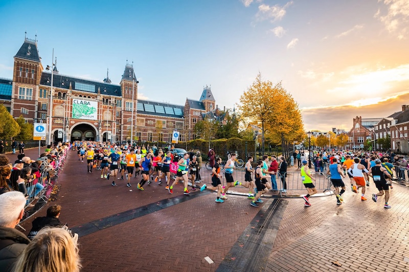 Runners on the Amsterdam Marathon 2026 course, highlighting route details and training preparation tips.