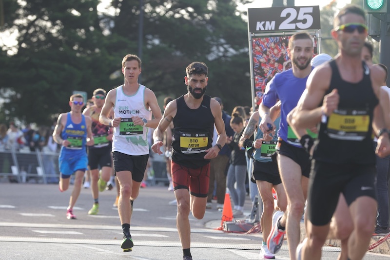 Runner racing the fast Valencia Marathon course in pursuit of a personal best time