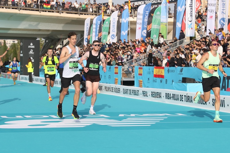 Runners racing through Valencia Marathon’s fast city course in pursuit of a personal best.