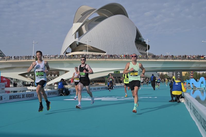 Runner racing the Valencia Marathon on a fast, flat course toward a personal best.